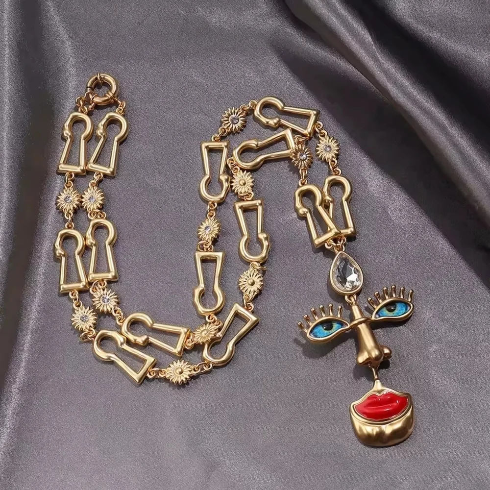 Gold-tone Abstract Face Pendant Necklace with Red Lips - Picture 2 of 5